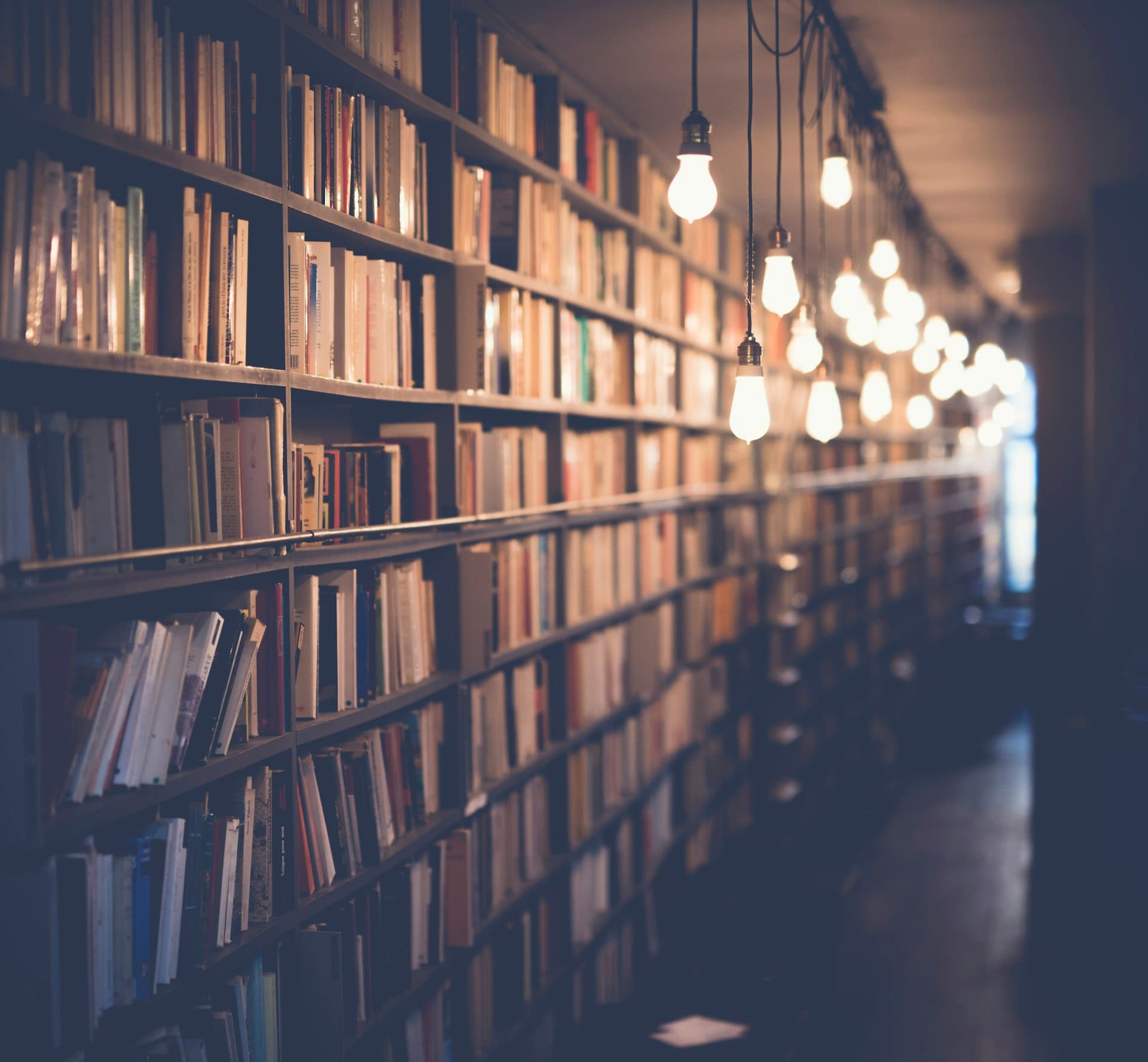 Long library aisle lined with bookshelves